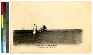 People travelling through the desert, India, ca.1920-1940