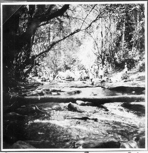 Crossing a river on an evangelization journey, Tanzania, ca.1927-1938