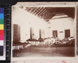 Medical missionary working on ward, possibly at the Ralph Wardlaw Thompson Hospital, Chikballapur, Karnataka, India, ca. 1912-1920