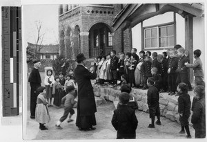 Maryknoll Fathers Allie and Booth with children's choir, Peng Yang, Korea, ca. 1930-1950