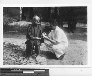 Dr. Blaber treating a patient at Xinhui, China, 1934