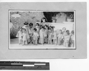 Sister Mary Richard with orphans at Luoding, China, 1927