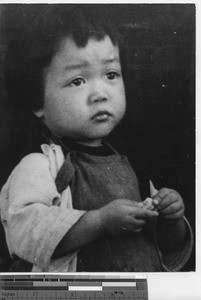 An orphan girl at Yangjiang, China, 1946