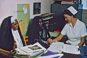 Missionary, nurse Anne Lise jensen with two patients at the American Mission hospital in Bahrai