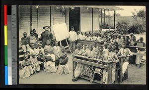 Missionary father teaching children outdoors, Congo, ca.1920-1940