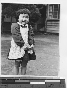 A shy orphan girl at Kunming, China, 1947