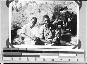 Two African health assistants writing letters, Nyasa, Tanzania, ca. 1938