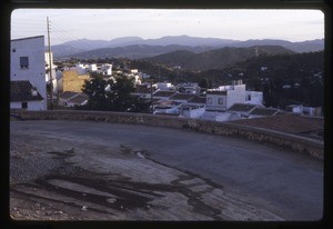 village with houses in the foreground and mountains in the background