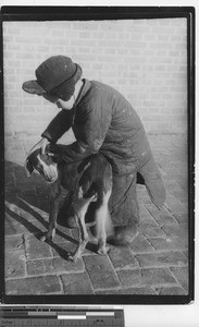 A boy and his dog at Fushun, China, 1937