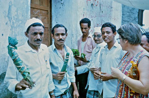 Missionary Martha Holst in conversation with young arab men in Aden in 1960