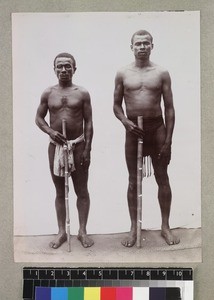 Full length double portrait of farmers, Madagascar, ca. 1910