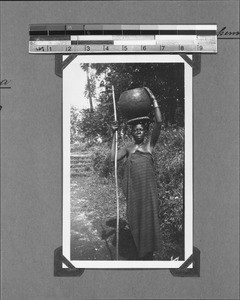 Woman carrying a pot of water, Nyasa, Tanzania