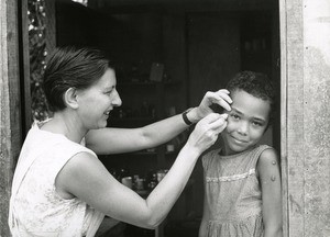 Mrs. Domercq treating a girl, in Lambarene, Gabon