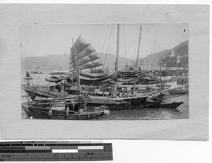 Junks and ferries in Hong Kong Harbor, China, 1921