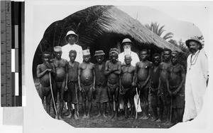 Three missioners and a group of men, Africa, 1939