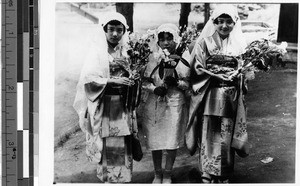 Group of girls standing outside holding bouquets after first Holy Communion, Fushun, China, 1931