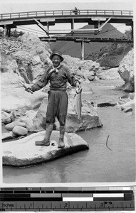 Smiling fisherman with his catch, Japan, August 1932