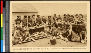 Missionary sisters and orphans preparing fish, Canada, ca.1920-1940