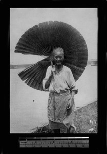 Old woman with parasol, China, ca.1921