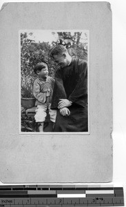 Fr. Donaghy and a boy at Meixien, China, 1930