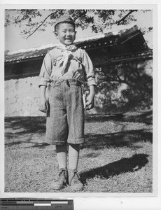 A boy dressed in his Sunday clothes at Wuzhou, China, 1949