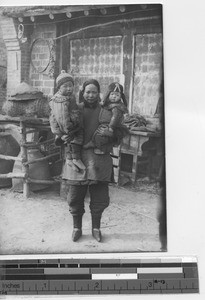 A Chinese woman and her children at Chaoyangzhen, China, 1940