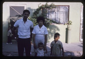 Family outside their home