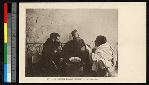 White-clad man feeding another, Ethiopia, ca.1920-1940