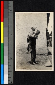 Man carrying his mother to be baptized, Shaoxing, Zhejiang, China, ca.1930-1940