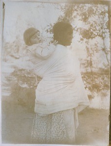 Malagasy woman with a child of missionaries, in Madagascar