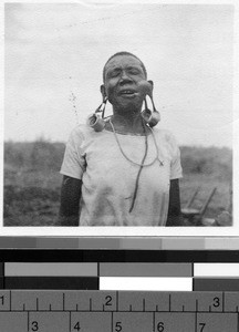 Man smoking a pipe, Africa, March 1948