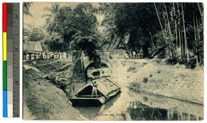 Man in a boat on a river, India, ca.1920-1940