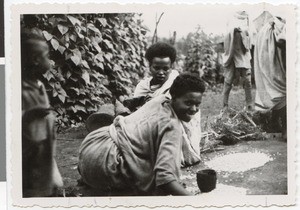 Women cleaning grain, Guduru Gute, Ethiopia, ca.1952-1953