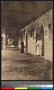 Missionary fathers standing inside brick mission building, Congo, ca.1920-1940