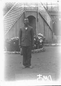 African man standing in front of the mission house, Makulane, Mozambique, ca. 1896-1911