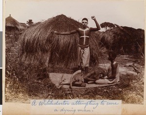 A witch doctor attempting to cure a dying man