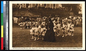 Children marching with flowers at school in Asmara, Eritrea, ca.1920-1940