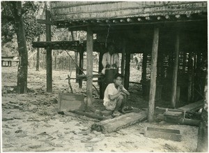 A blacksmith's shop in Pahandut. In the background the bellows on two hollow pieces of wood