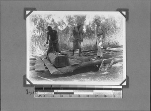 Africans cutting boards, Mbozi, Tanzania