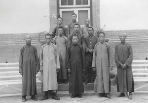 A group of men 9(patients or assistants in front of the Siuyen Hospital