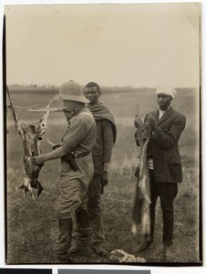 Adolf Müller cutting up a gazelle, 1928