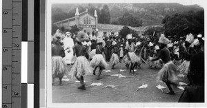 Men dancing in a dirt clearing, Tanganyika, Tanzania, Africa, March 8, 1949