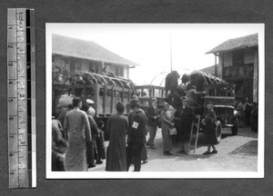 Missionaries mounting a truck, Tibet, China, ca.1941