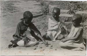 African girls playing jacks