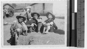 Four boys sitting outdoors, Guatemala, ca. 1946