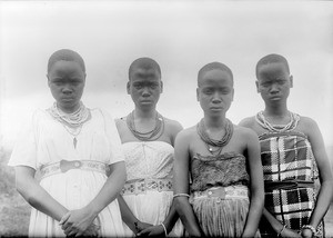 Four African girls with folded hands, Tanzania, ca.1893-1920