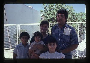 Family outside Iglesia de Cristo