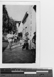 Orphans go to church for baptism at Luoding, China, 1933