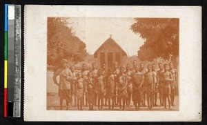 Catechist and students outside a church, Kanzenze, Congo, ca.1920-1940