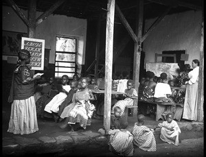 Classroom in the girls' boarding school in Aburi. Miss Brugger and indigenous teachers